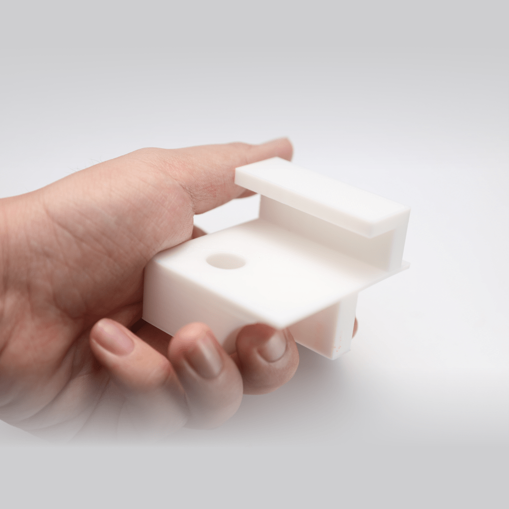 Hand holding a 3D print with Snapmaker breakaway PLA support, easy to remove. 